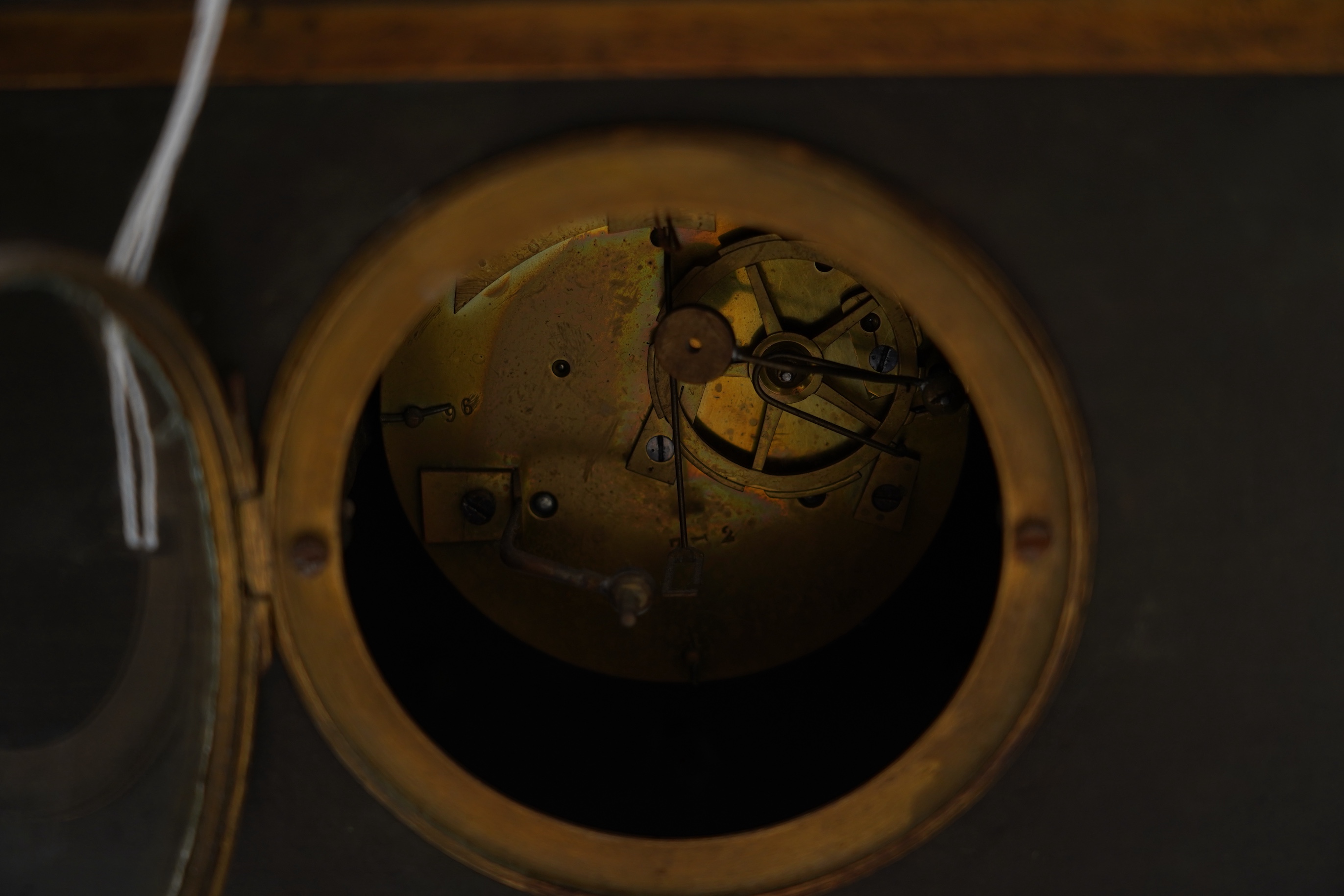A late nineteenth century brass and bronze cased clock, mounted with a part gilt bronze of a mounted Turkish soldier and woman